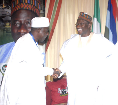 Ozi in handshake with President Jonathan
