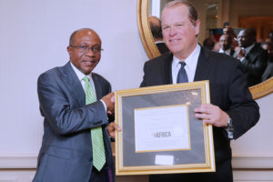 CBN GOVERNOR AWARD IN US 1: The Governor, Central Bank of Nigeria (CBN), Mr. Godwin Emefiele (left) receiving the 2017 Forbes Best of Africa Innovative Banking Award from the President of Forbes Customs Emerging Markets, Mr. Mark Furlong at a dinner held at the Willard Intercontinental, Washington, on the sidelines of the Annual Meetings of the World Bank and the International Monetary Fund (IMF) in Washington DC Thursday, October 12, 2017. PHOTO; SUNDAY AGHAEZE