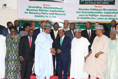 PRESIDENT BUHARI ATTENDS AFRICAN ASSOCIATION OF CBN GOVERNORS 39TH SESSION 4A. President Muhammadu Buhari in a handshake with the CBN Govenor and Vice Chairman AACB, Mr Godwin Emefiele (R) and others during the Assembly of Governors Association of African Central Banks 2016 Symposium held at the Apex Bank in Abuja. PHOTO; SUNDAY AGHAEZE. AUGUST 18 2016