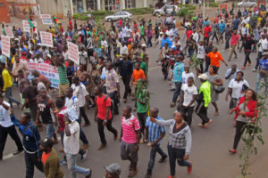 People take part in a march to show their support for the Cameroon army fighting against Boko Haram militants in the city of Yaounde, Cameroon, Saturday, Feb. 7, 2015. Boko Haram staged an overnight assault on a border town in Niger, residents said Sunday, the second time the West African nation has come under attack by the Nigeria-based extremists since Friday. (AP Photo/Joel Kouam)