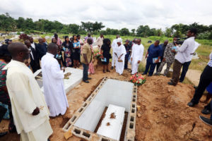 O.J ABUAH BURIAL 0A&B. Wife of Late Director of Information State House, Mr Justin Abuah, Mrs Nonyem with the Children during the burial at the Gudu Cemetery in Abuja. PHOTO; SUNDAY AGHAEZE. SEPT 16 2016