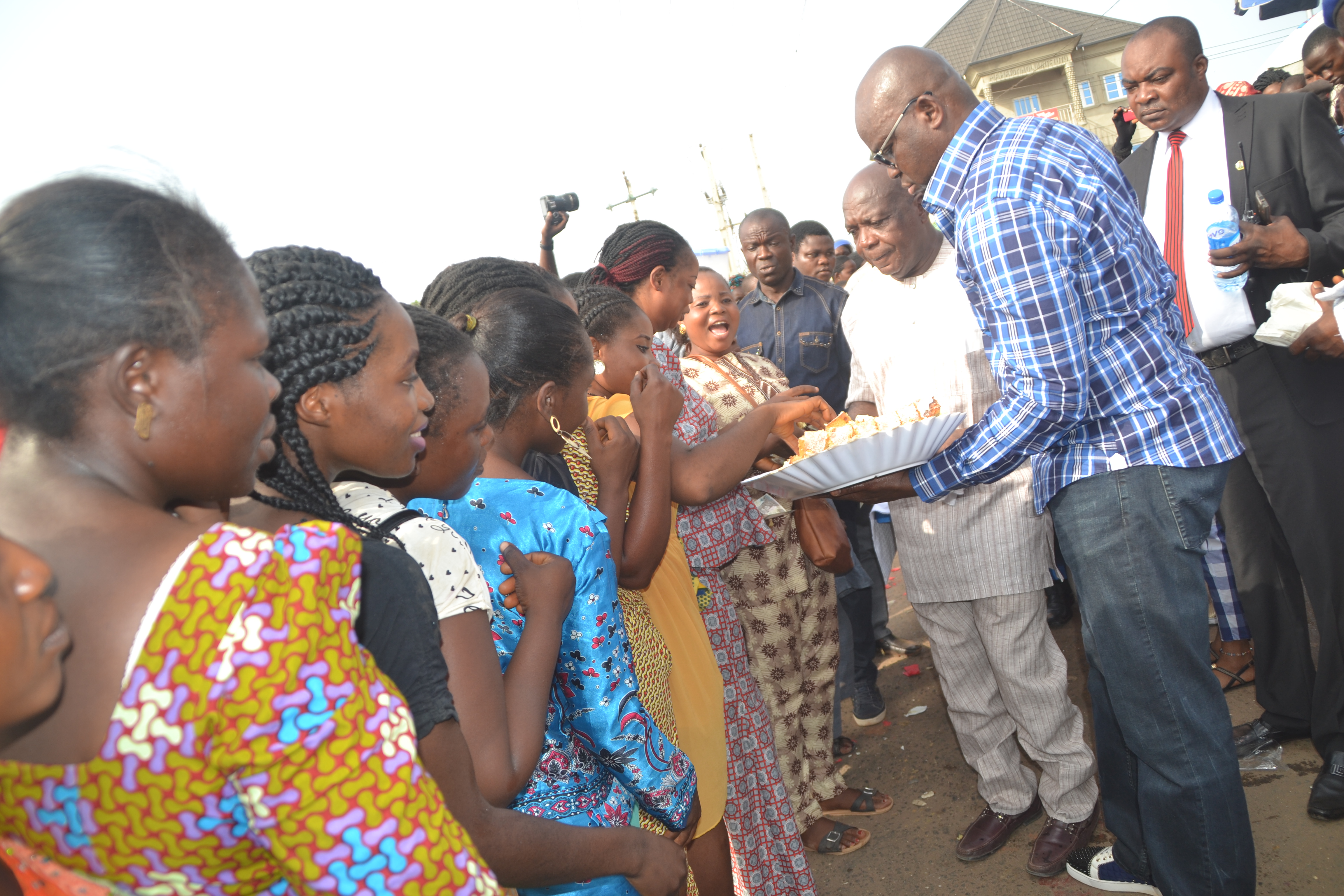Fayose Shares Cake, Cash, Bottle Of Coke To Passers-By To Mark His 56th Birthday