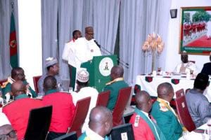 PRESIDENT BUHARI ATTENDS ARMY REGIMENTAL DINNER OA. The President Muhammadu Buhari addressing cross section of officers during the 2016 Regimental dinner night with Guards Brigade in Abuja. PHOTO; SUNDAY AGHAEZE. DEC 30 2016