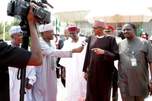 PRESIDENT BUHARI DEPARTS ABUJA FOR UK (10 DAYS LEAVE) 5A&B. President Muhammadu Buhari (M) Flanked by Chief of Staff, Mallam Abba Kyari and SA Media and Publicity, Mr Femi Adesina as the President chats with the Press on his departure from Abuja for UK on 10 days leave at the Nnamdi Azikwe International Airport Abuja. PHOTO; SUNDAY AGHAEZE. JAN 19 2017