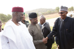 PRESIDENT BUHARI RETURNS 000. R-L; President Muhammadu Buhari in a hand shake with Vice President Yemi Osinbajo, Chief of Staff, Mallam Abba Kyari on arrival at the Presidential Villa in Abuja. PHOTO; SUNDAY AGHAEZE. MAR 10 2017.
