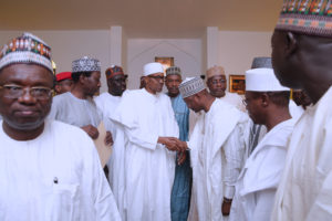 JUMA'AT 4.  L-R; NSA Maj Gen Babagana Mongonu, President Muhammadu Buhari (M) in a hand sjhake with Minister of Justice and Attorney General Abubakar Malami during the Juma'at prayers. PHOTO; SUNDAY AGHAEZE. MAY 5 2017