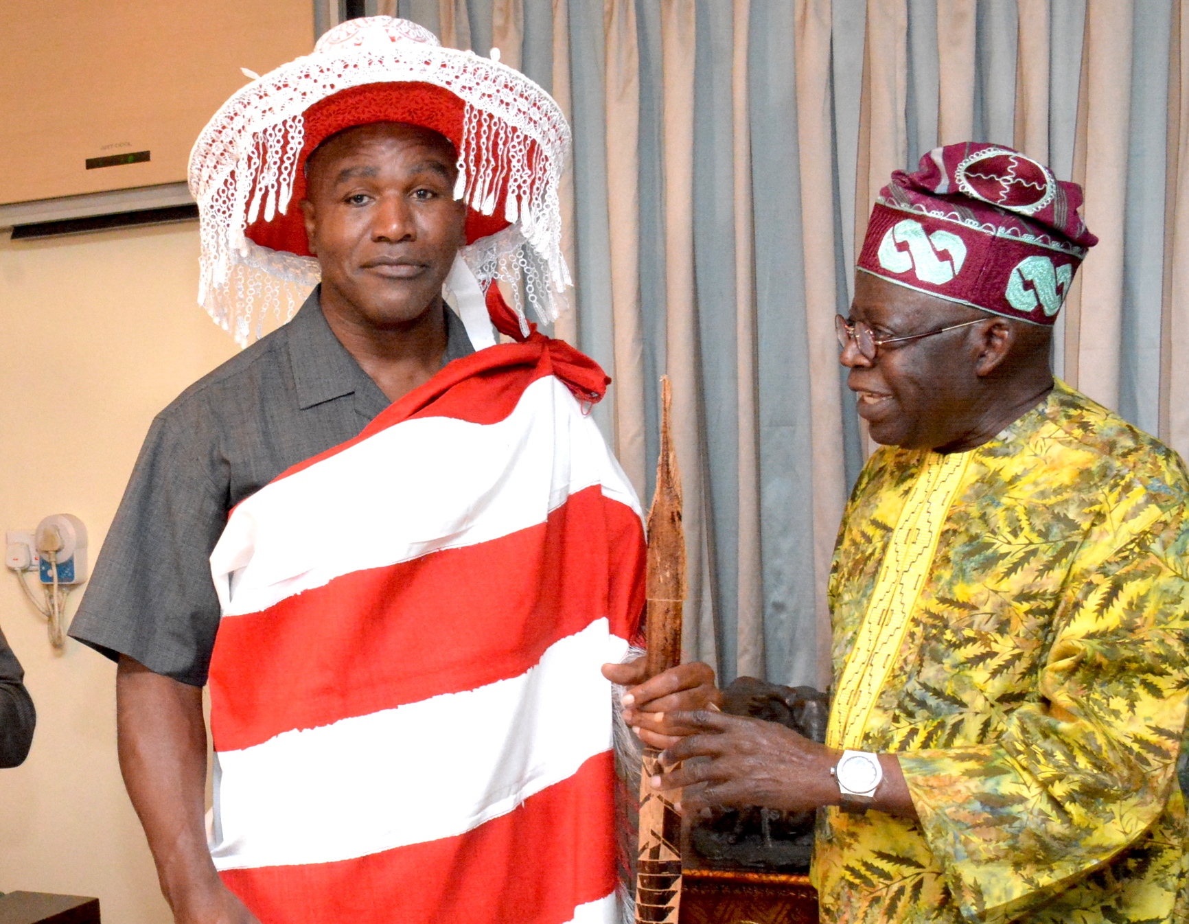 Tinubu Welcomes Ex World Boxing Champion, Evander