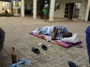 Dino Melaye Lying On Floor, In Front Of DSS Head Office, Abuja