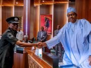 Buhari In Handshake With Confirmed Police Boss