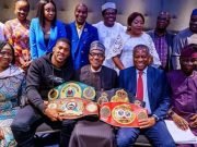 World Heavyweight Boxing Champ Bows Before Buhari