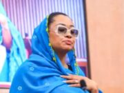 Senator Natasha’s Airport Antics, Noise Masken For Courage, By Ken Harries